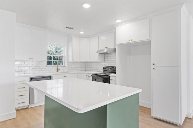 kitchen with white cabinetry, dishwasher, decorative backsplash, a center island, and black range with electric cooktop