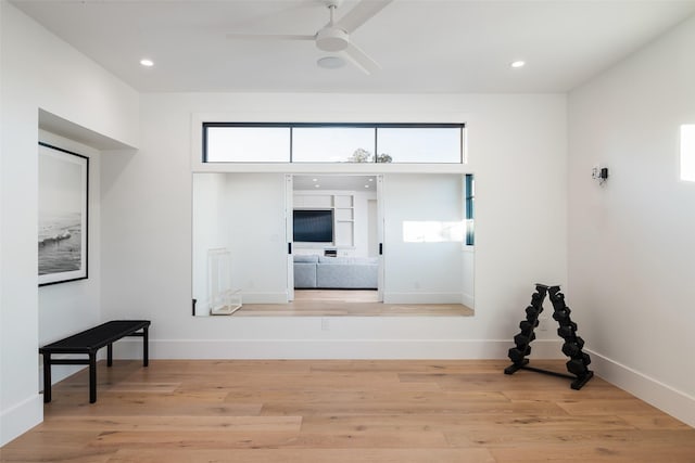 interior space featuring light hardwood / wood-style flooring and ceiling fan