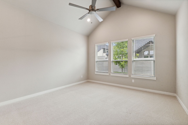 empty room featuring ceiling fan, carpet flooring, and vaulted ceiling with beams