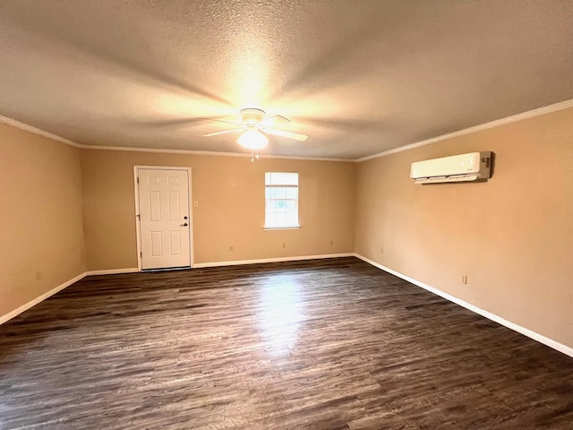 spare room with ornamental molding, a wall unit AC, dark hardwood / wood-style floors, and ceiling fan