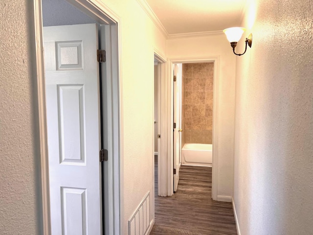 corridor with crown molding and dark hardwood / wood-style floors