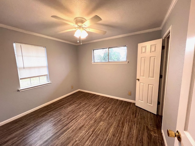 unfurnished bedroom featuring crown molding, dark wood-type flooring, a textured ceiling, and ceiling fan