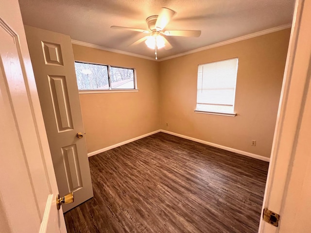 empty room with ceiling fan, crown molding, and dark hardwood / wood-style flooring