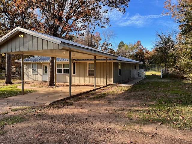 ranch-style house featuring a carport