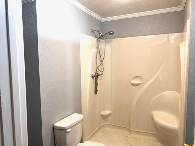 bathroom with a shower, ornamental molding, a textured ceiling, and toilet