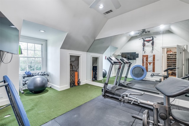 exercise room featuring vaulted ceiling, ceiling fan, and carpet flooring