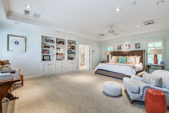 bedroom featuring crown molding, ceiling fan, connected bathroom, and a raised ceiling