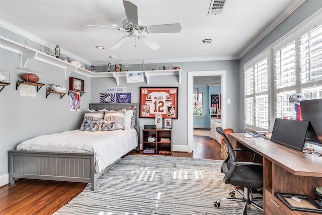 bedroom featuring wood-type flooring, ornamental molding, and ceiling fan