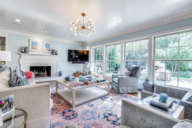 living room with ornamental molding, wood-type flooring, and an inviting chandelier