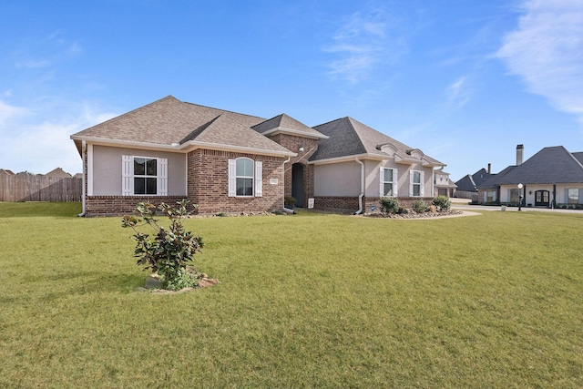 single story home with a front yard