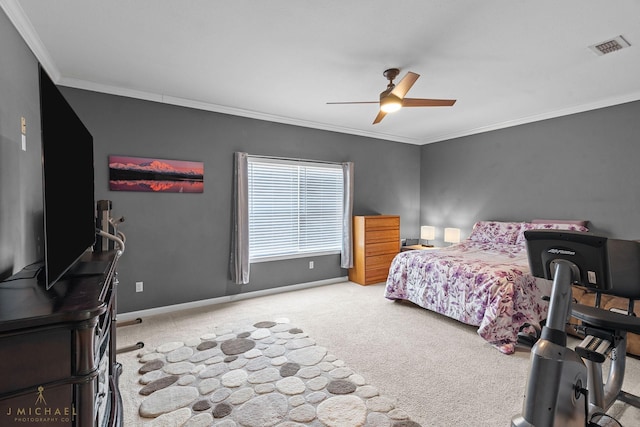 carpeted bedroom featuring ornamental molding and ceiling fan