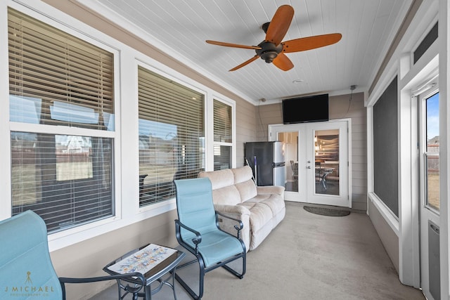 sunroom / solarium with french doors, ceiling fan, and wooden ceiling