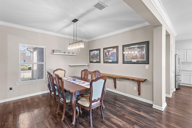 dining room featuring crown molding and dark wood-type flooring