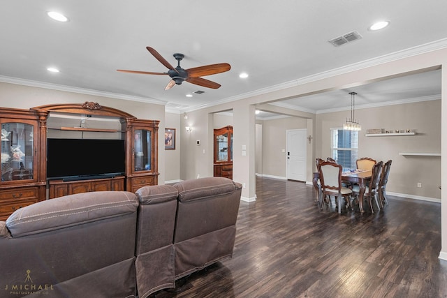 living room with crown molding, ceiling fan, and dark hardwood / wood-style floors