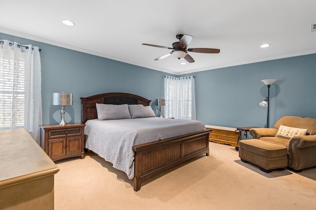 bedroom with multiple windows, ornamental molding, and ceiling fan