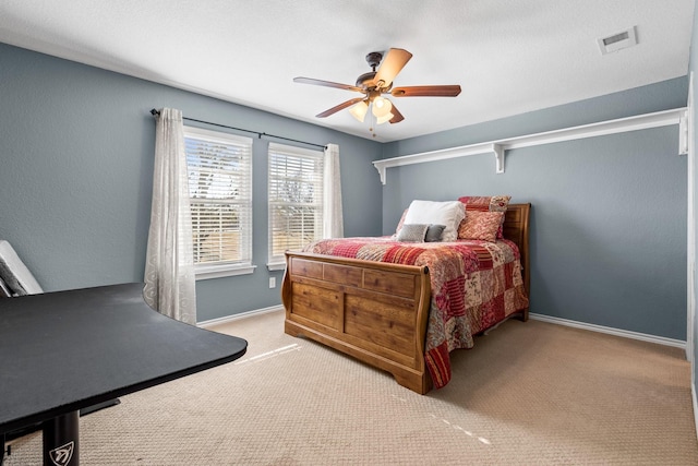 carpeted bedroom featuring ceiling fan