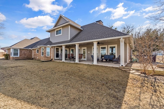 back of property featuring a patio, a yard, an outdoor hangout area, and ceiling fan