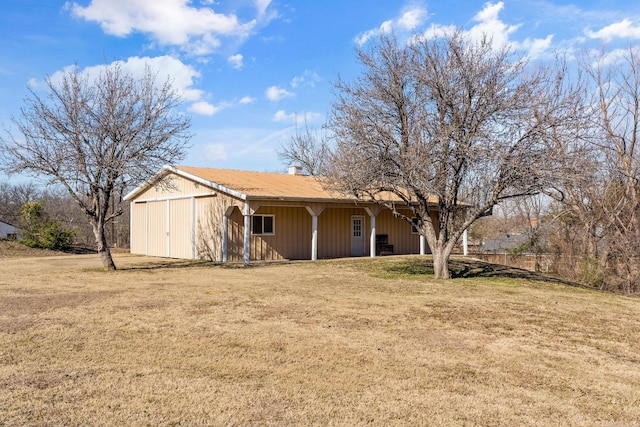 exterior space with an outbuilding and a yard