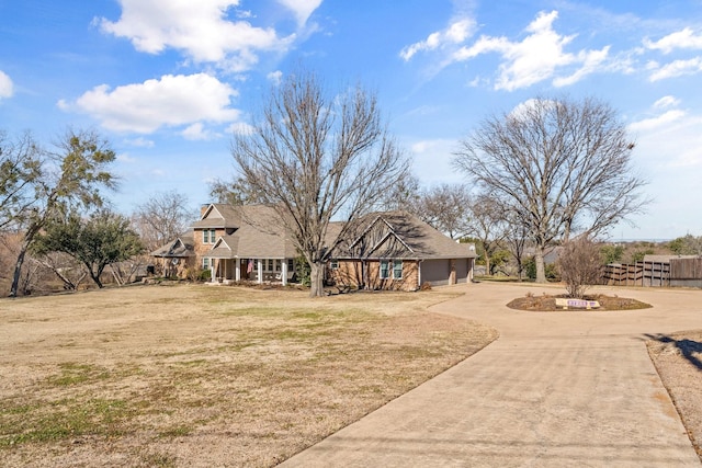 view of front of home with a garage and a front yard