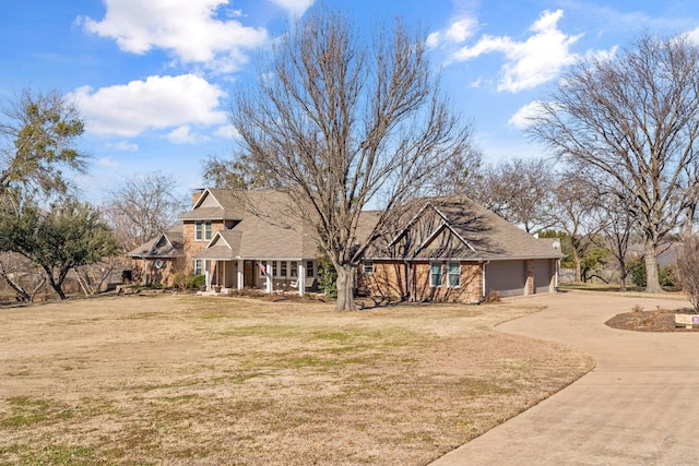 view of front facade with a garage and a front lawn