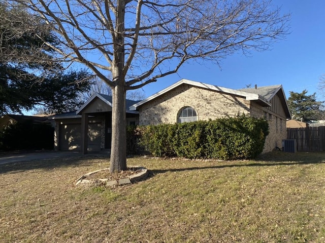 view of front of property with cooling unit and a front yard