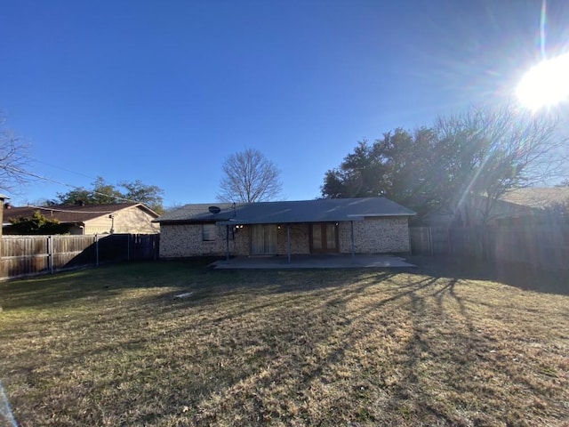 view of front of property with a front lawn and a patio area