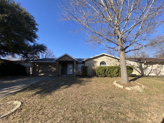 ranch-style home with a front yard and a carport