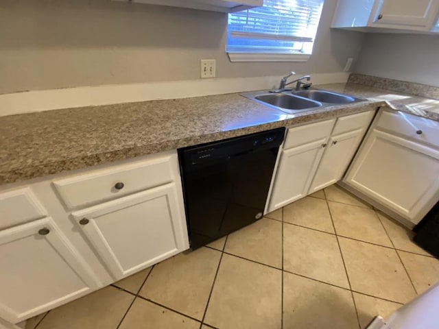 kitchen with sink, white cabinets, black dishwasher, and light tile patterned flooring