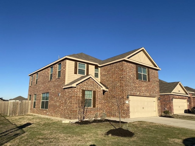 view of front facade with a garage and a front lawn