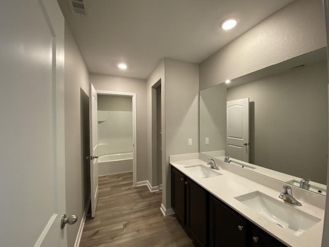 bathroom featuring vanity and wood-type flooring