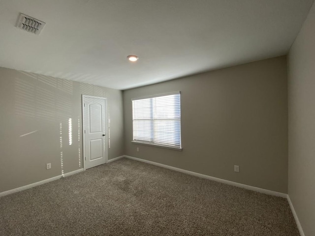 spare room with carpet floors