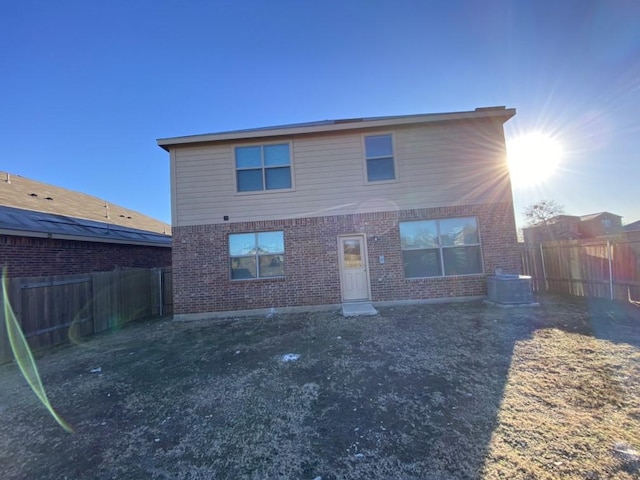 back of house featuring central AC