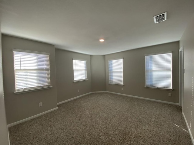 spare room with carpet floors