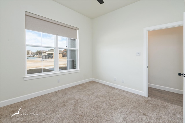 carpeted empty room with ceiling fan