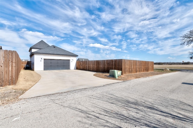 view of property exterior with a garage