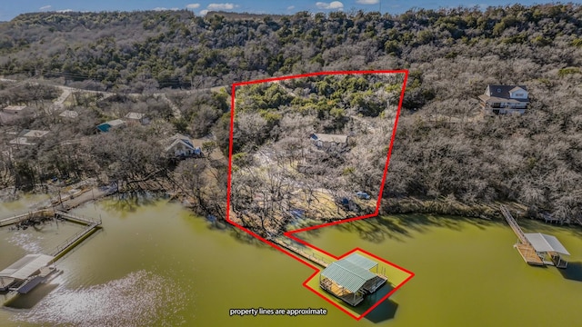 birds eye view of property featuring a water view