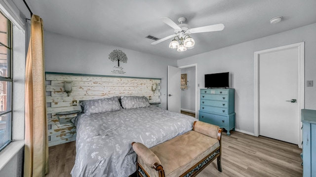 bedroom featuring ceiling fan and light hardwood / wood-style floors