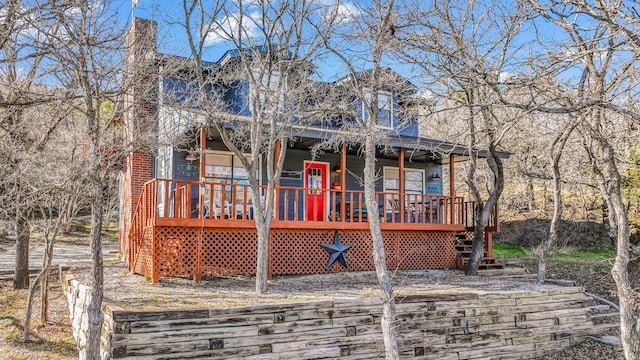 view of front of house featuring a wooden deck