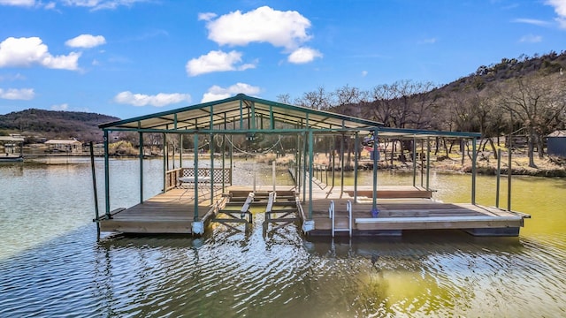 dock area with a water and mountain view