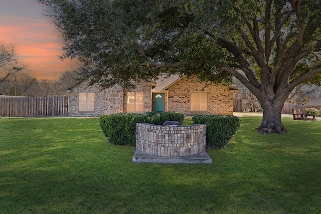 view of yard at dusk