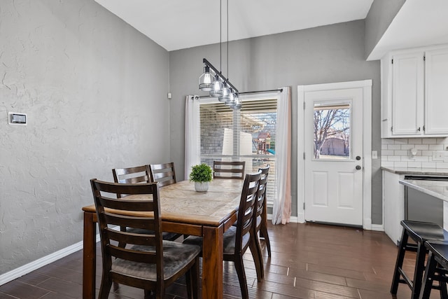 dining area featuring dark hardwood / wood-style flooring