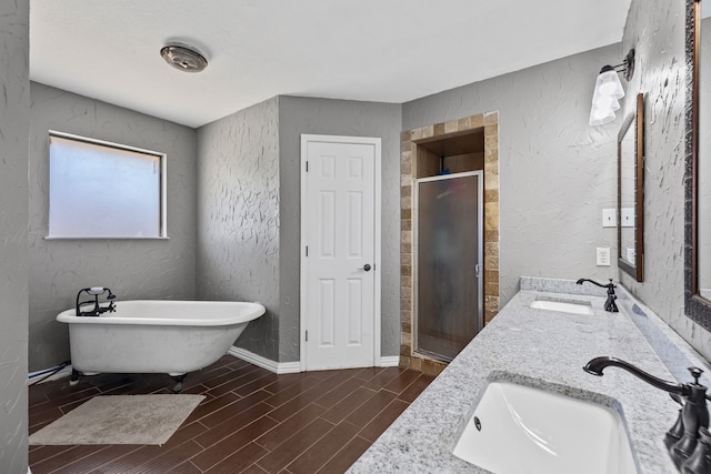 bathroom featuring vanity and independent shower and bath