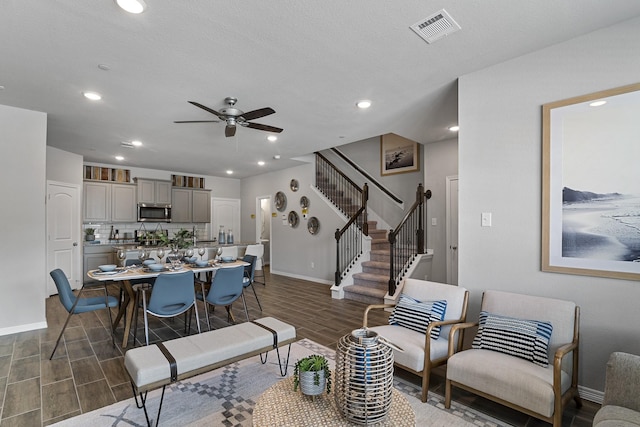 living room featuring ceiling fan