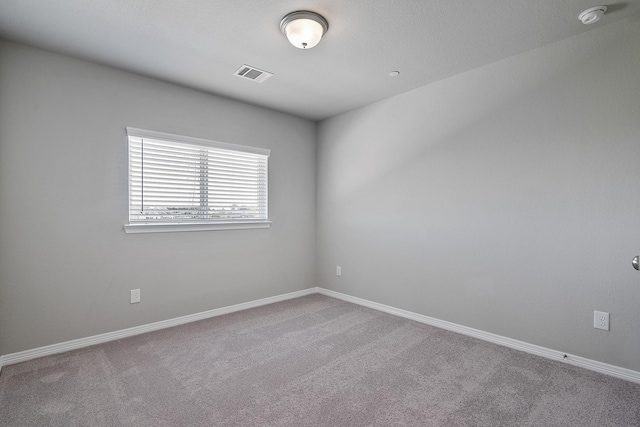 unfurnished room with carpet floors