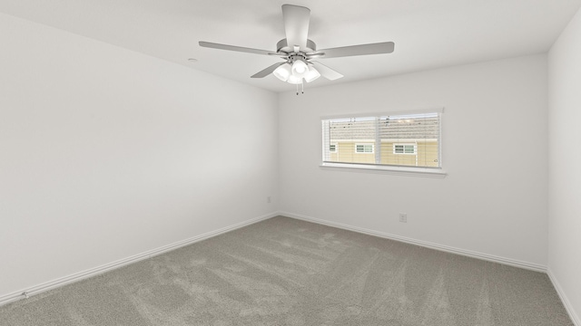unfurnished room featuring baseboards, carpet flooring, and ceiling fan