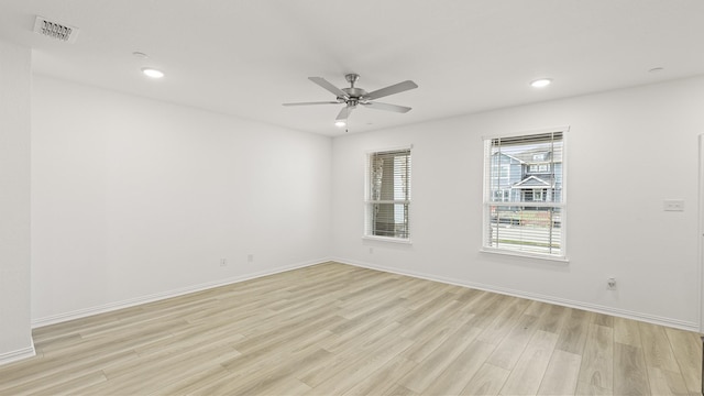unfurnished room featuring a ceiling fan, visible vents, baseboards, light wood finished floors, and recessed lighting