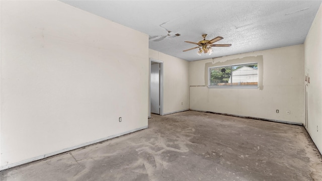 empty room featuring ceiling fan and a textured ceiling