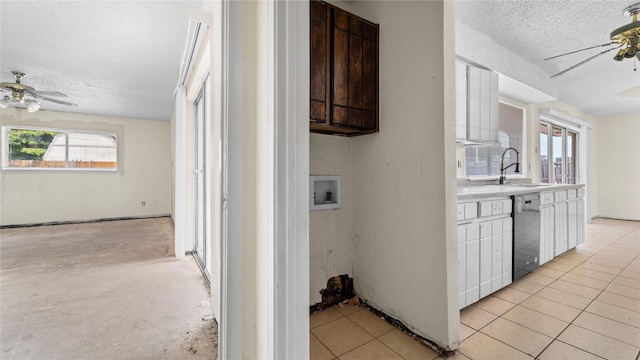 kitchen with ceiling fan, stainless steel dishwasher, sink, and dark brown cabinets