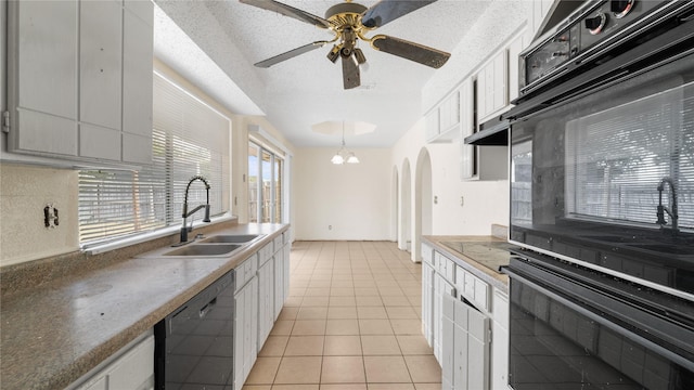 kitchen with white cabinetry, dishwasher, and sink