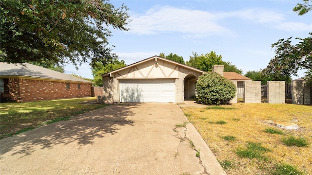 single story home with a garage and a front yard